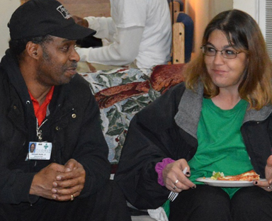 2 people sitting on a couch, one is counselling the other