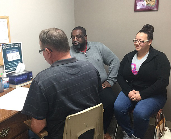 A couple talking to crisis relief staff